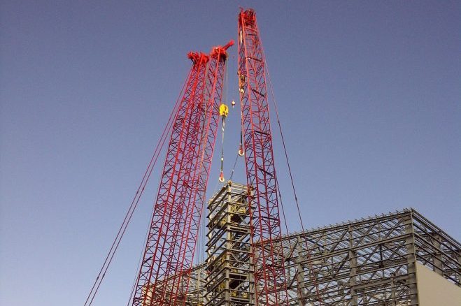top running crane worker planning critical lift